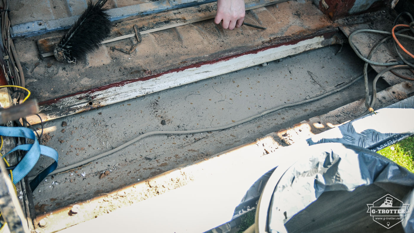 The compartment in the floor after the floor plate had been removed. 