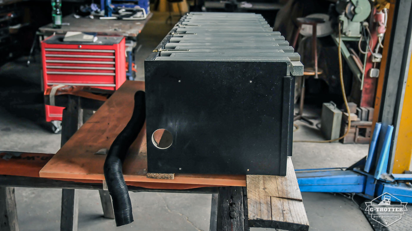 The air heater is placed in the bench. For fresh air intake and heated air exhaust we had to cut two holes into this piece of furniture.