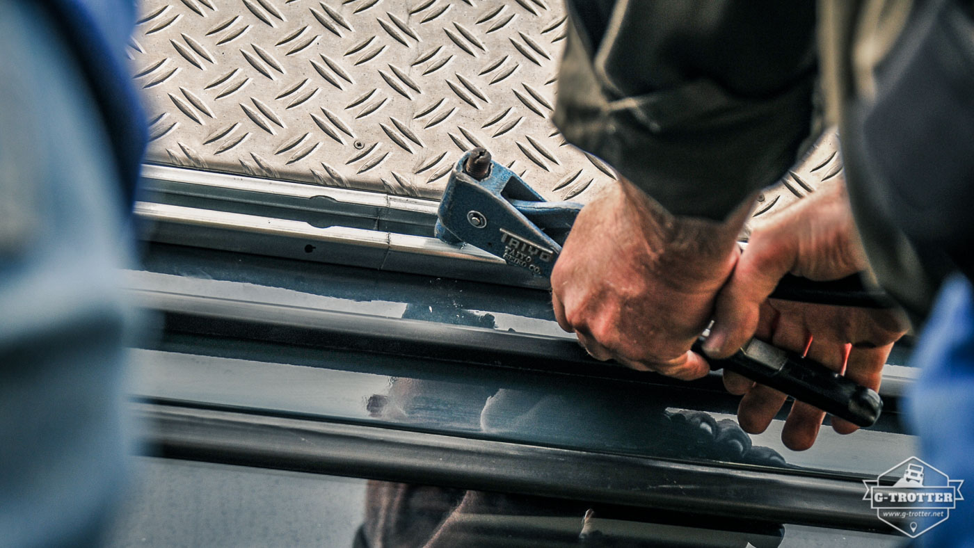 We riveted the rail onto the car's body.