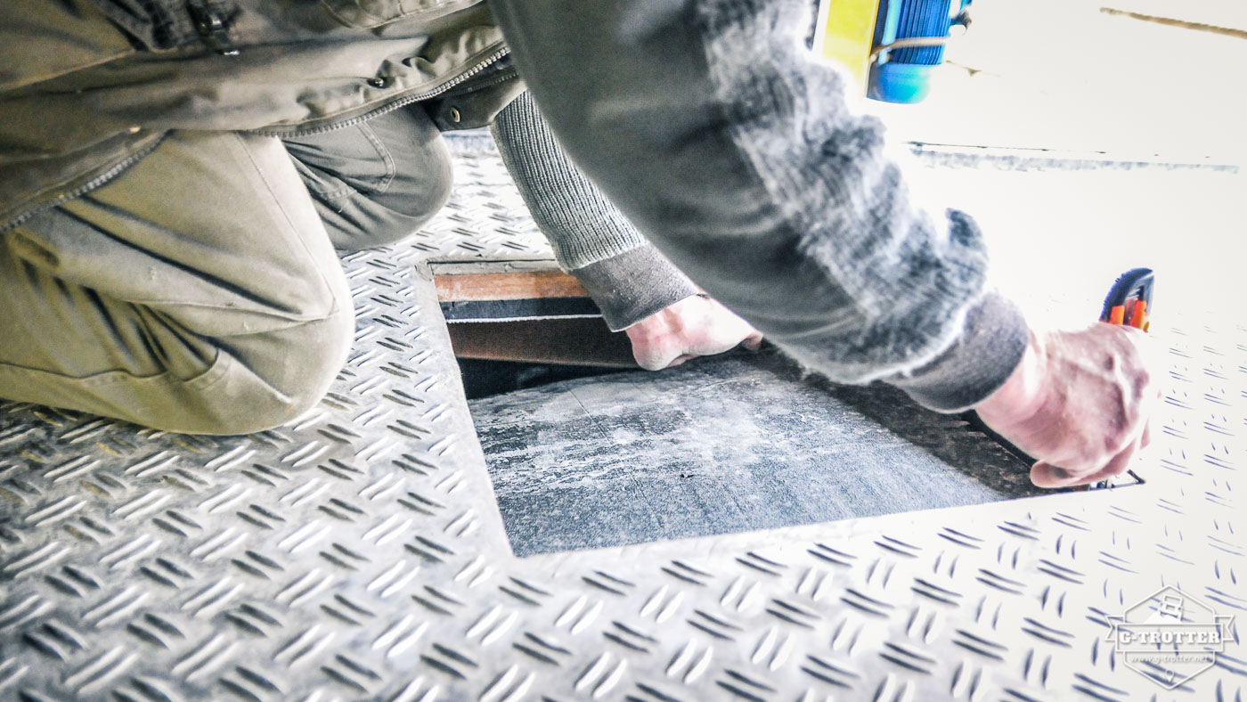 In order to fit in the new hatch, the insulation material needed to be cut away. 