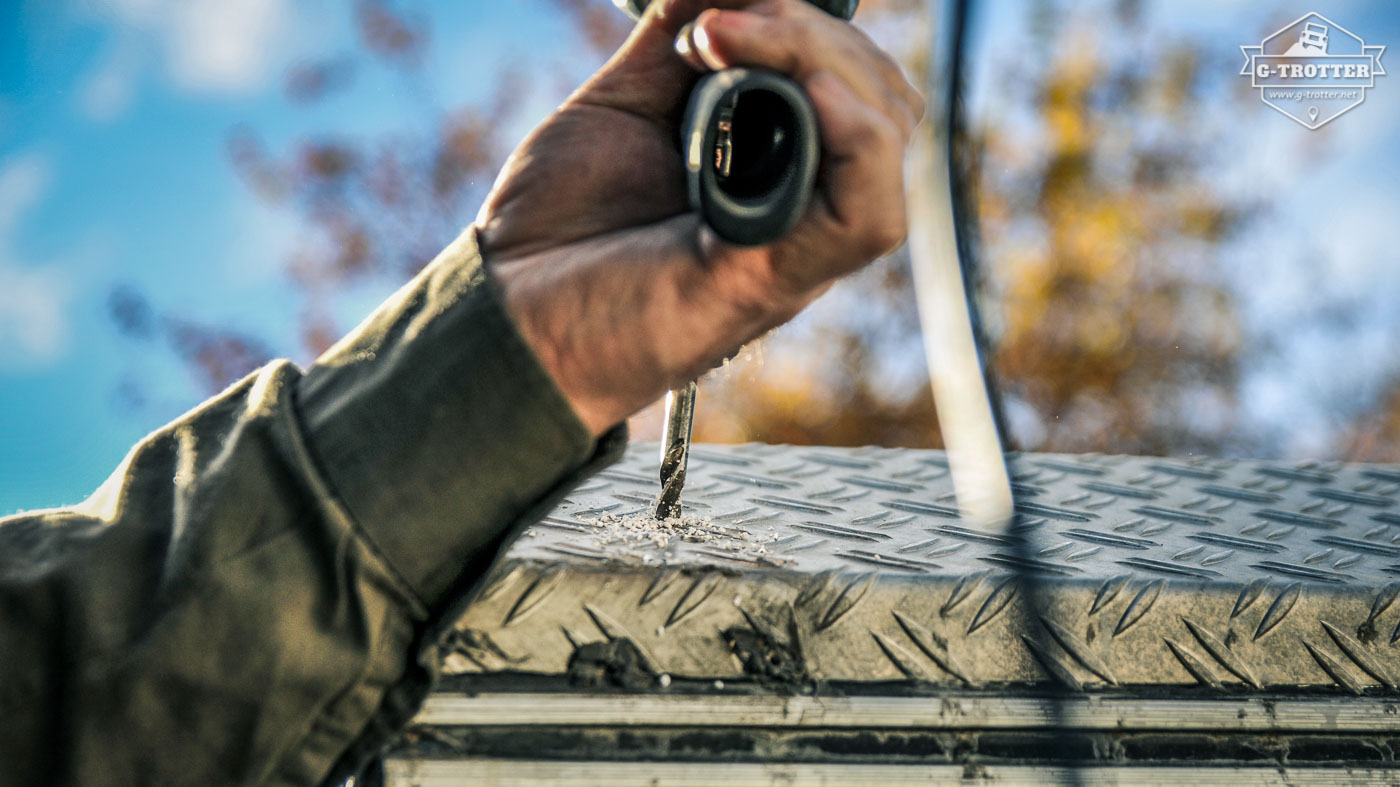 For the installation of additional headlights on the roof, we had to drill some holes first. 