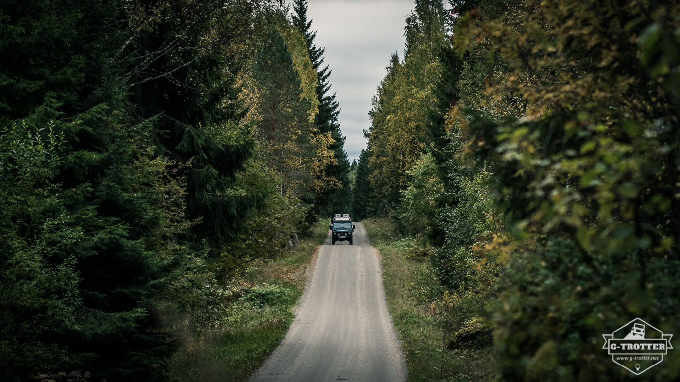 A typical Finnish road surrounded by forests.