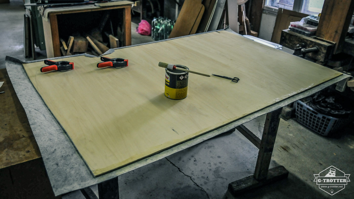 The plywood plate for the wall waits to be clothed with carpet. 